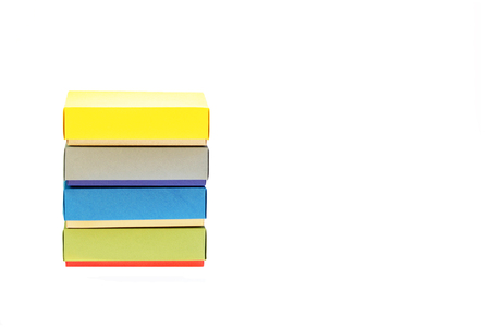 Few colorful paper boxes of colored cardboard for packing bow ties and other gifts on a white background. Hand made.の写真素材