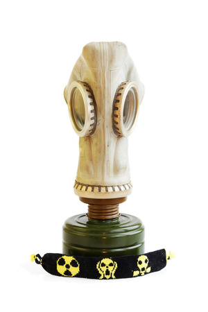 trophy stalker old Russian gas mask and yellow-black baubles on a white background. concept of stalking. Isolatedの写真素材