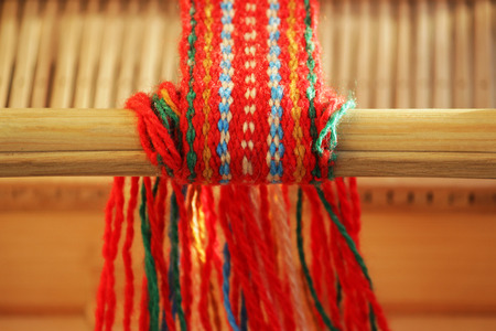 Weaving mini machine for making belts with patterns. Folk art, handmade. Detailの写真素材