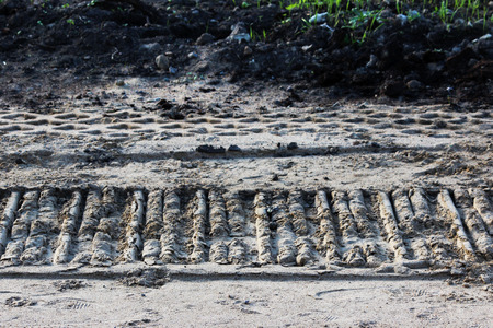 One detail footprint wheel crawler excavator in the sand on the site to build a road. Gatchinaの写真素材
