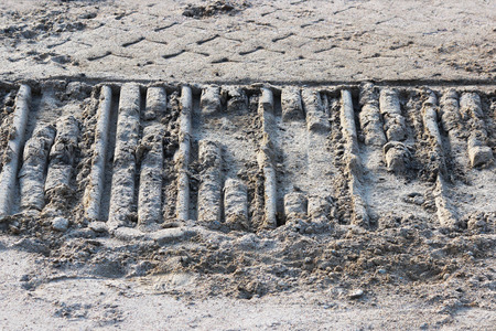One detail footprint wheel crawler excavator in the sand on the site to build a road. Gatchina.の写真素材