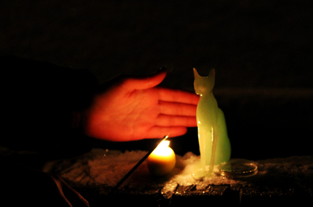 a ritual for the fulfillment of desires with a full moon on the street, with a statue and a candle. January 31, 2018.の写真素材
