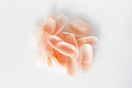 many plastic pink tips for nail extension and training in applying design while training a manicureの写真素材