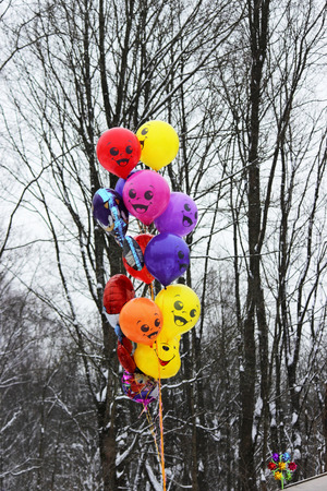 Colorful balloons on a background of black and white trees at the Shrovetide festival of 2018. Russiaの写真素材