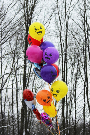 Colorful balloons on a background of black and white trees at the Shrovetide festival of 2018. Russiaの写真素材