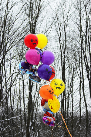 Colorful balloons on a background of black and white trees at the Shrovetide festival of 2018. Russiaの写真素材