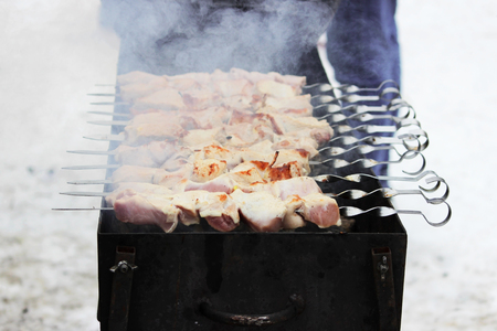 cooking meat shish kebab in the open air during the celebration of the Russian folk celebration of Pancake Day, 2018. Russiaの写真素材