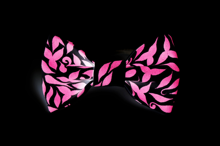 one beautiful small butterfly made of cloth on the hair bands to create a hairstyle on the head on a black background. computer processing, inversionの写真素材