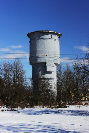 water tower against a blue sky. vertical arrangementの写真素材