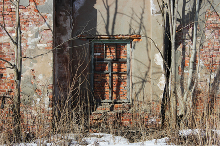 old brick ruins that remained from the historic house. a window embedded in bricks.の写真素材