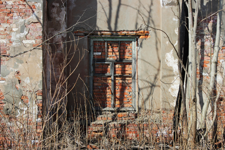 old brick ruins that remained from the historic house. a window embedded in bricks.の写真素材