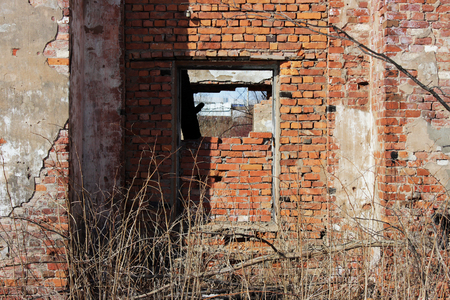 old brick ruins that remained from the historic house. a window embedded in bricks.の写真素材