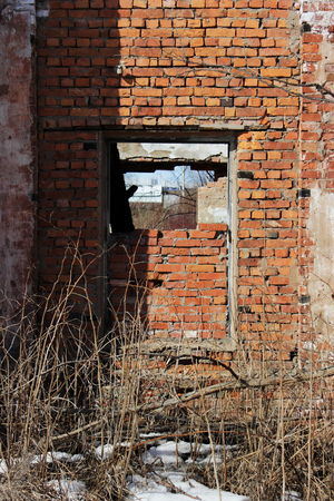 old brick ruins that remained from the historic house. a window embedded in bricks.の写真素材