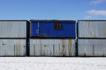 building trailers placed on each other near the city market. the door is at a heightの写真素材