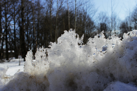 melting dirty snow piled up by a bunch after cleaning the road. Spring.の写真素材