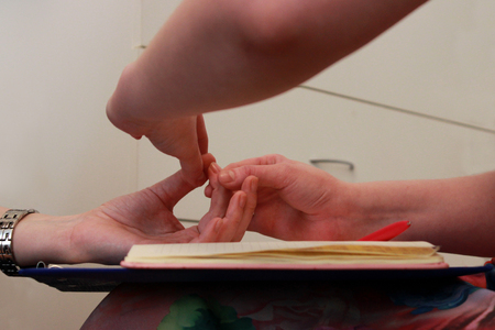 two girls hold hands on a course on teaching esoteric techniques. check the muscle test. passing the basic course on the study of esoteric techniques.の写真素材
