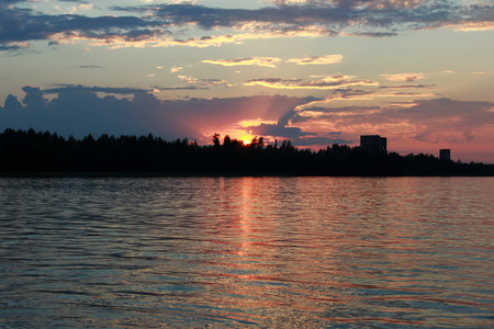 Lake Vysokinskoye in the summer, with pink clouds during the colorful sunset. Leningrad Region, Russiaの写真素材