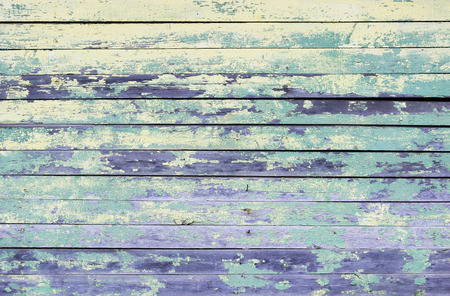 Vintage wood background with peeling turquoise old flaky paint.の写真素材