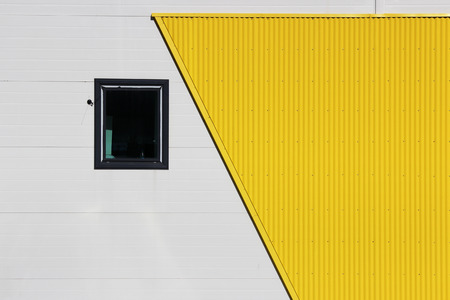 One window in a large shopping center on a beige and yellow backgroundの写真素材