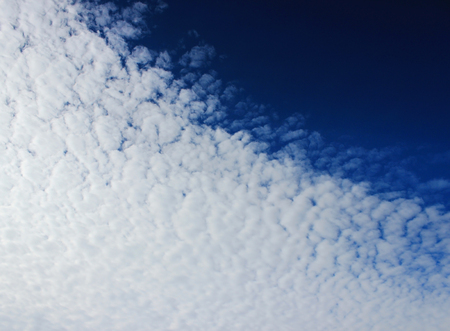 The boundary of cirrus clouds in the bright blue sky.の写真素材