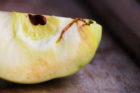 a trace of apple worms in apple. source of infection of apple by the Brown rot Monilia fructigena mold on the skin of a rottingの写真素材
