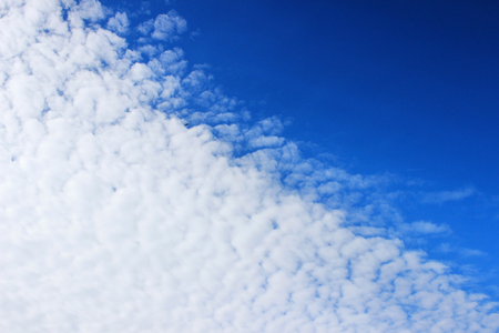 The boundary of cirrus clouds in the bright blue sky.の写真素材