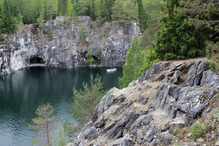Ruskeala marble quarry, Karelia, Russia. turquoise water in the river and gray with white veins of the shore, forest.の写真素材