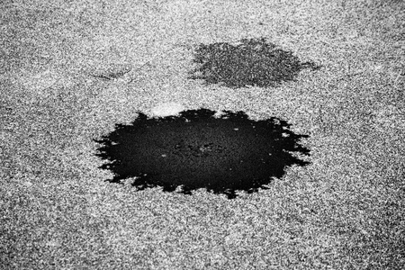 round small hole in thin ice on a lake in the Gatchina park.の写真素材
