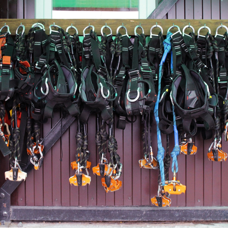 Many mounts hang in the rental point for zipline above the lake with a marble canyon, Karelia.の写真素材