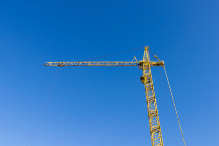 Crane on the background of the sky working in the cityの写真素材