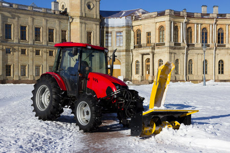 snow combine harvests dirty snow on the road. Gatchina, Russia. snow removal, reportage shootingの写真素材