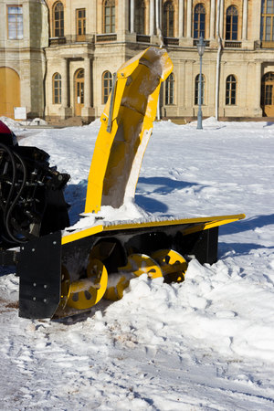 snow combine harvests dirty snow on the road. Gatchina, Russia. snow removal, reportage shootingの写真素材