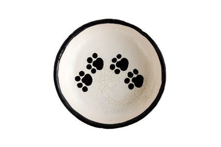 Defective product: homemade plate with cat legs. handwork. black on white. when the melting temperature of the clay and the glaze does not match, a cracks skin is formed - the crazing in the glaze are shown.の写真素材