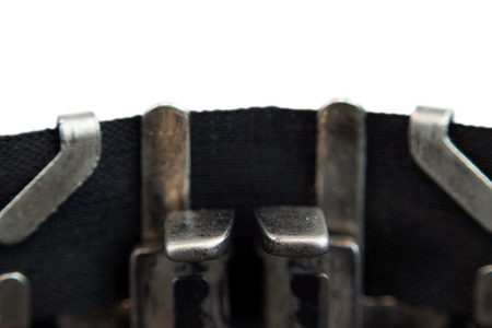 Old soviet typewriter close up. Filled in it blank sheet of paper without words. Macro. Isolatedの写真素材