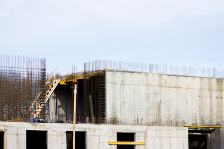 the workers on building a large wellness center with a swimming pool of modern technology with concrete poured reinforced and formwork walls. reportage.の写真素材