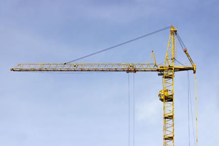 Crane on the background of the sky working in the cityの写真素材