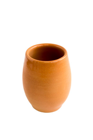 Clay pot, made by hand on a potters wheel from red clay. Double burning. Transparent glaze applied by hand. Handmade, single copy. Isolated on a white backgroundの写真素材