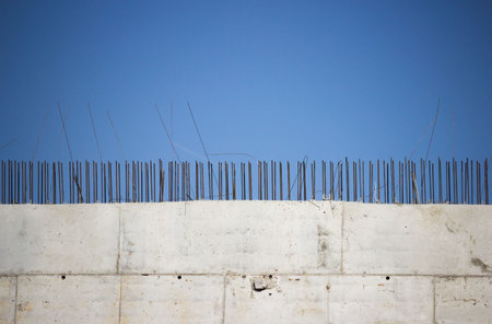 wall of the building, built of slabs and ends of reinforcing wire. building a large wellness center...