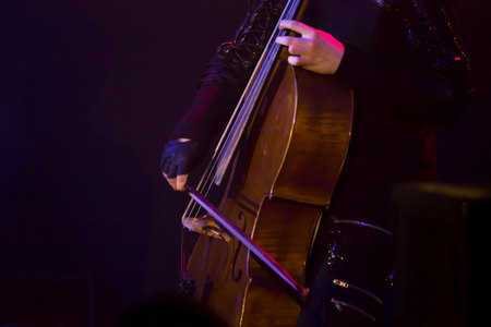 man musician with a cello on the stage. reportage.の写真素材