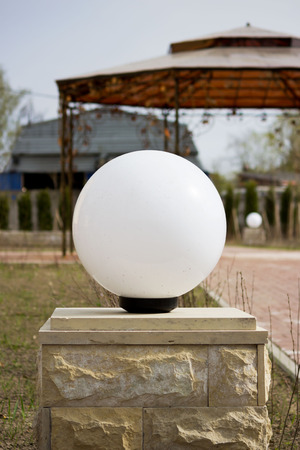 round lamps and a wrought iron gazebo on the territory of the registry office for the marriage ceremony.の写真素材