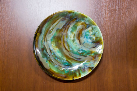 meeting potters. training courses for novice ceramists. reportage. ceramic example of clay with different green emerald glazesの写真素材