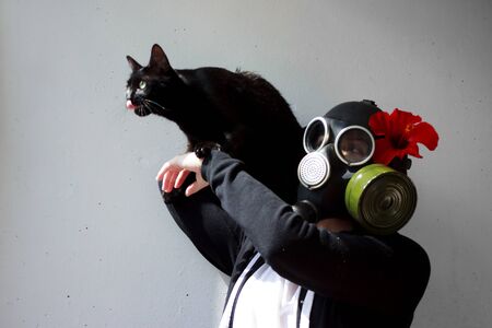 girl in gas mask with black cat. The Cat Lady. cosplayの写真素材