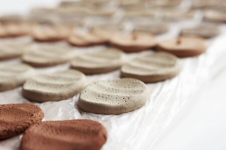 clay samplers dry. Spanish stone masses in the form of round pellets for testing glazes.の写真素材