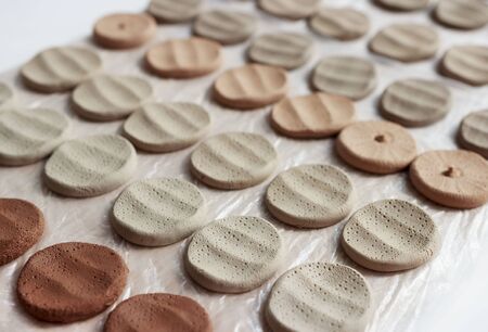 clay samplers dry. Spanish stone masses in the form of round pellets for testing glazes.の写真素材