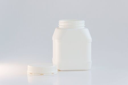 white plastic jar with lid on a white background.の写真素材