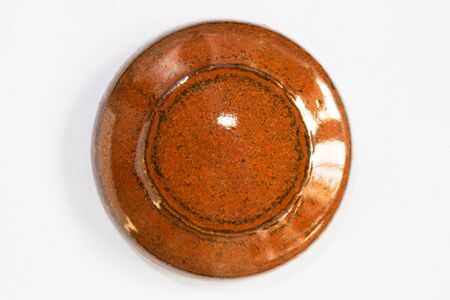 round clay probe with brown glossy glazeの写真素材