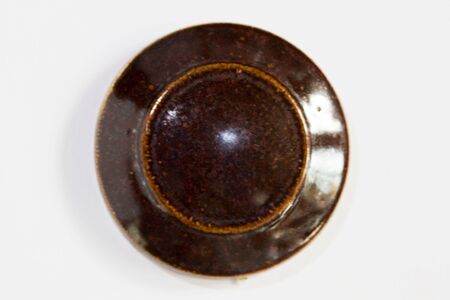 round clay probe with brown glossy glazeの写真素材