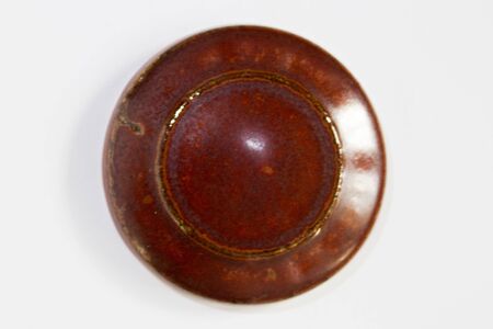 round clay probe with brown glossy glazeの写真素材