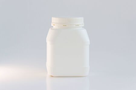 white plastic jar with lid on a white background.の写真素材