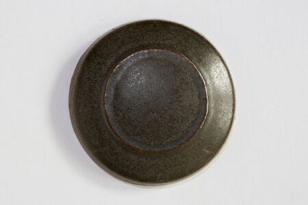 round clay probe with brown matte glaze.の写真素材